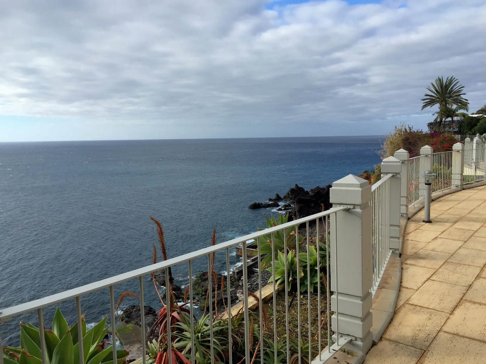 Ocean promenade with volcanic rock coastline