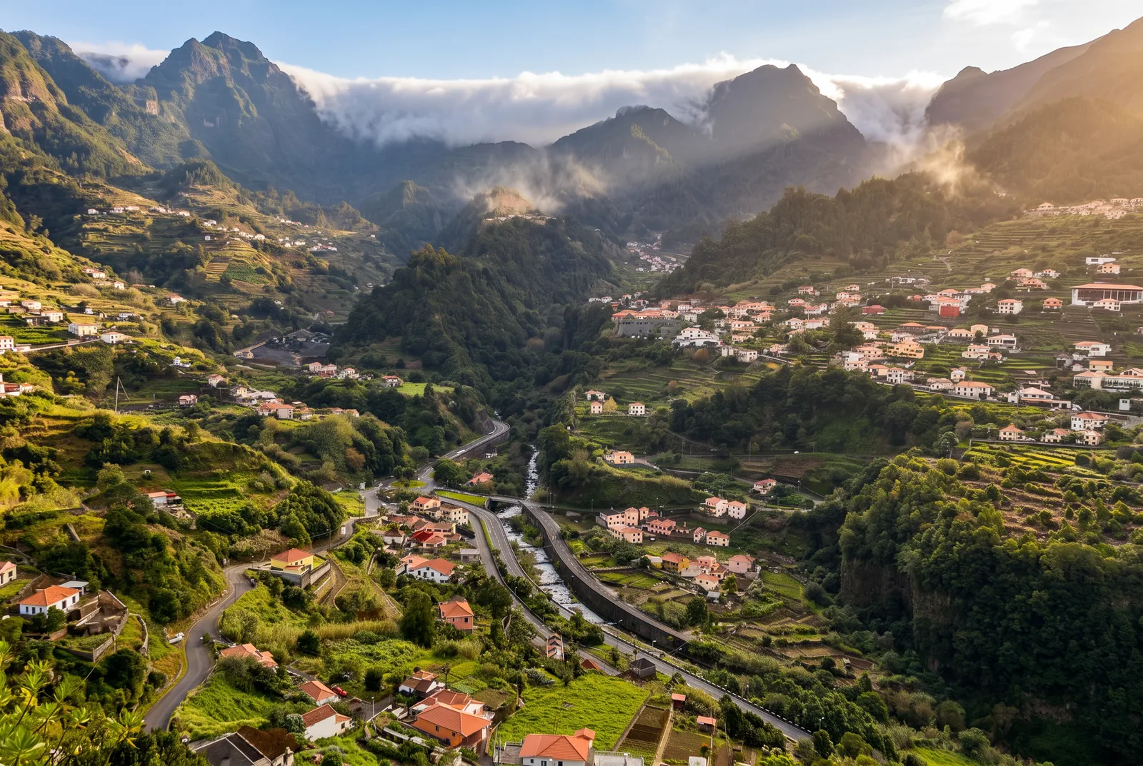 The São Vicente valley with terraced slopes, scattered houses and cloud spilling over the ridges