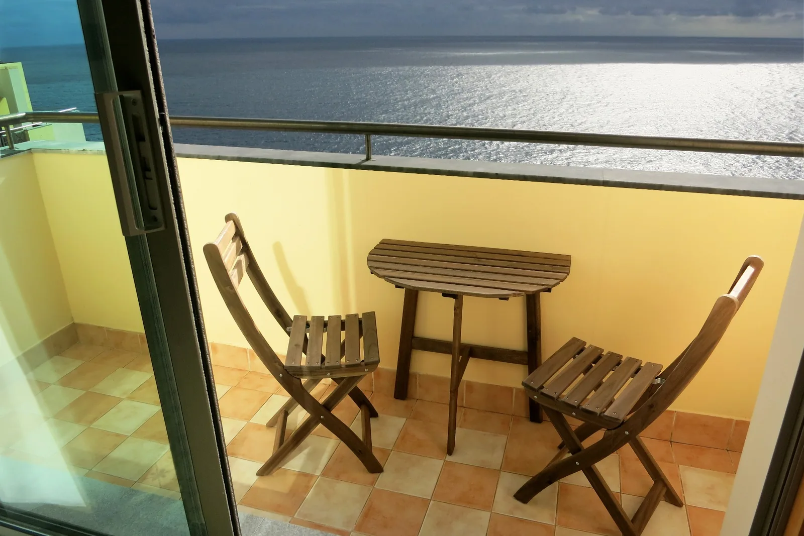 The balcony of the beachfront penthouse looking over the ocean