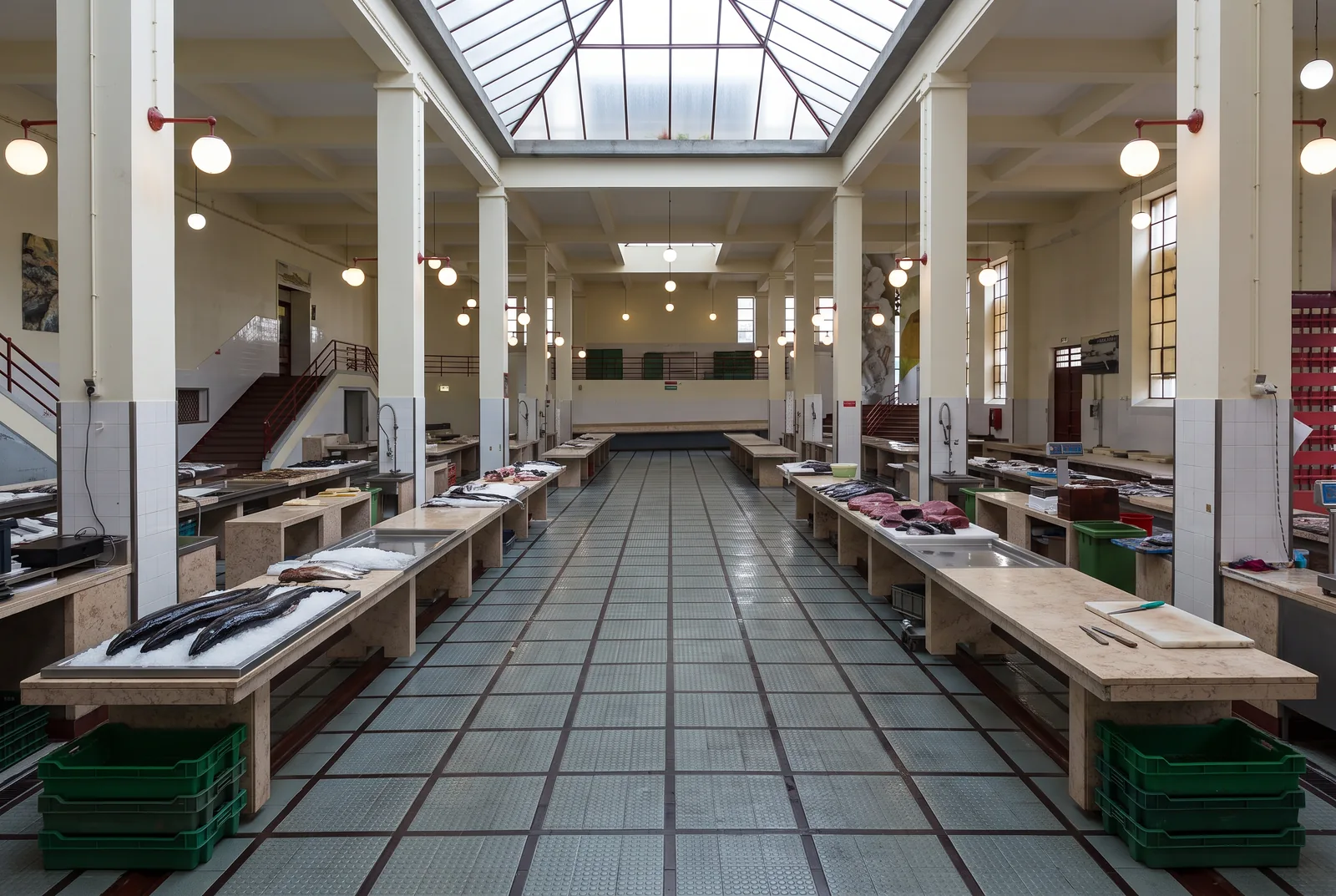 The fish hall of Mercado dos Lavradores before opening, with black scabbard fish laid out on ice